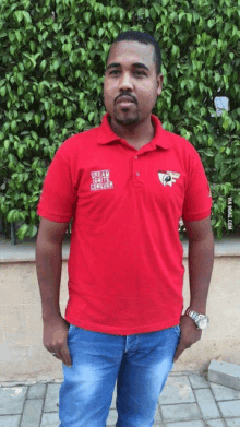 a man wearing a red polo shirt that says death rights center