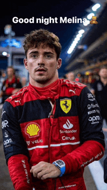 a man wearing a red and black jacket with sponsors such as santander teva and shell