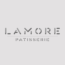 a logo for lamore patisserie is displayed on a white background