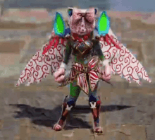 a person in a colorful costume with wings is standing on a dirt field .