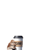 a cat 's paw is reaching out towards a cup that says gm on it