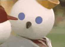 a jack in the box snowman with blue eyes