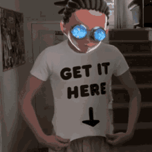 a man wearing a white shirt that says get it here