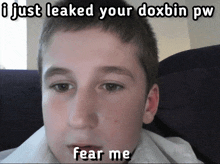 a picture of a young boy with the caption i just leaked your doxbin pw