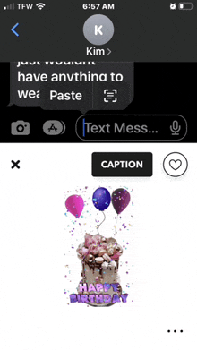 a phone screen shows a birthday cake with balloons and says happy birthday