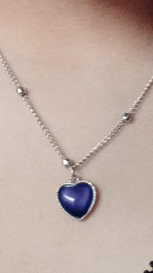 a necklace with a blue heart shaped pendant on it