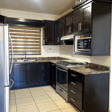 a kitchen with a stove top oven and a microwave