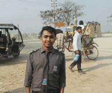 a man stands in front of a sign that says ' ambulance service ' on it