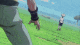 a person holding another person 's hand in a field of grass