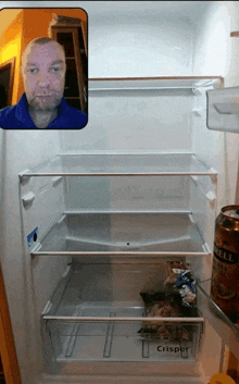 an empty refrigerator with a can of crisper in the freezer