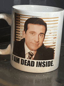 a mug with a picture of michael scott and the words i am dead inside