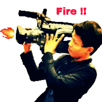 a man is holding a camera with the word fire written on the bottom