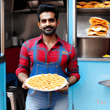 a man in an apron is holding a plate of food in front of a food truck