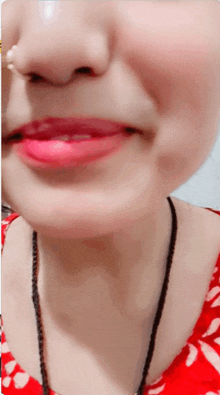 a close up of a woman 's face with red lips