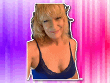 a woman in a blue bra with a pink background