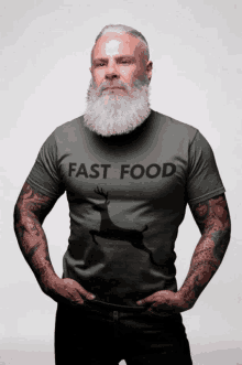 a man with a beard wears a fast food t-shirt