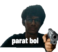 a man with glasses is pointing a gun at the camera with the words parat bol written above him