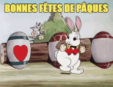 a cartoon rabbit is standing in front of a bunch of easter eggs and says bonnes fetes de paques .