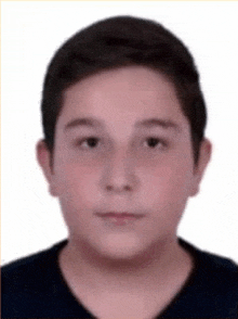 a young boy is wearing a black shirt and looking at the camera with a white background .