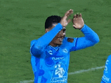 two soccer players are hugging each other on the field and one has the number 4 on his jersey