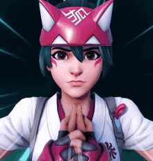 a girl wearing a pink and white mask with a symbol on it