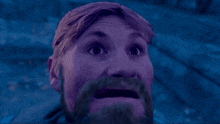 a man with a beard and purple hair looks very surprised