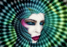 a woman 's face is surrounded by a circular pattern of dots