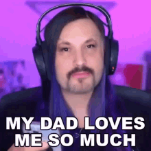 a man with long hair and headphones is saying `` my dad loves me so much '' .