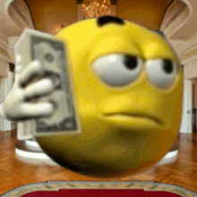 a yellow smiley face holding a stack of money