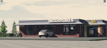 a car is parked in front of a mcdonald 's restaurant