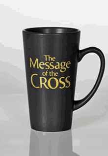 a black coffee mug that says the message of the cross on it