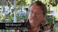 a man wearing glasses and a hawaiian shirt is named bill margold