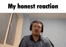 a man wearing headphones is sitting in front of a window and says `` my honest reaction '' .