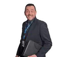 a man in a suit has a lanyard around his neck that says bbc on it