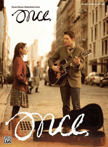 sheet music selections from the movie once with a man playing guitar