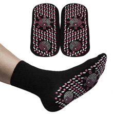 a pair of black socks with pink and white dots on them