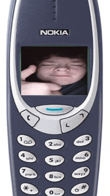 a nokia cell phone with a picture of a boy on the screen