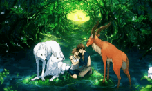 a man and a woman are kneeling next to a wolf and a deer