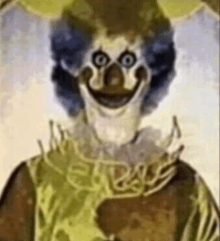 a close up of a painting of a clown with a smiley face .