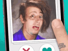 a phone screen shows a picture of a man with glasses and a heart icon