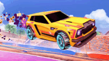 a yellow car is flying through the air on a purple track .