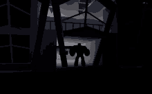 a silhouette of a robot is standing in the dark