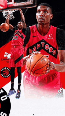 a toronto raptors basketball player is holding a basketball