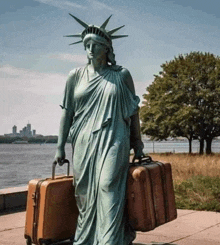 a statue of liberty carrying two suitcases on wheels