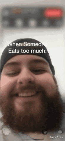 a man with a beard is smiling and says when someone eats too much faceapp