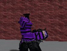 a person wearing a purple and black striped shirt is doing a handstand