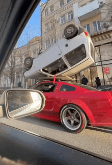 a red car has a kfc sign on the side