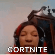 a woman wearing headphones is making a funny face in front of a clock and says gortnite .