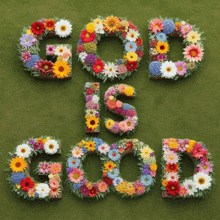 the word god is made out of flowers on a green background