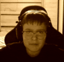 a pixelated image of a person wearing headphones and glasses